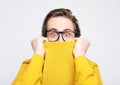 attractive man wearing yellow sweater astonished and amazed in shock and surprise face expression Royalty Free Stock Photo