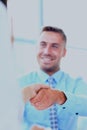 Attractive man and woman business team shaking hands at office building. Royalty Free Stock Photo