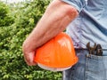 Attractive man holding construction helmet in his hands Royalty Free Stock Photo