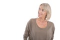 Attractive mature blond smiling woman looking sideways. Royalty Free Stock Photo