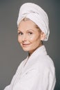 attractive mature woman in bath robe and towel on head Royalty Free Stock Photo