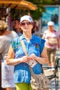 Attractive mature woman at the gastronomic festival