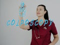 Attractive medico with marker writing COLPOSCOPY Cervical Biopsy Royalty Free Stock Photo