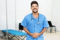 Attractive mexican male doctor is ready for vaccinating patients Royalty Free Stock Photo