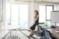 Attractive mid aged businesswoman standing in a modern office Royalty Free Stock Photo