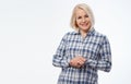 Attractive middle aged woman in a plaid shirt with folded arms isolated on white background Royalty Free Stock Photo