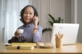 Attractive middle aged woman holding coffee drinking coffee and talking on a cell phone, having pleasant conversation Royalty Free Stock Photo