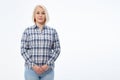 Attractive middle aged woman in a plaid shirt with folded arms isolated on white background Royalty Free Stock Photo