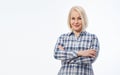 Attractive middle aged woman in a plaid shirt with folded arms isolated on white background Royalty Free Stock Photo