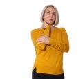Attractive Middle Aged Woman seriously thinks about her health. Woman in bright clothes posing in studio on white Royalty Free Stock Photo