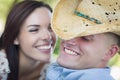 Attractive Mixed Race Couple with Cowboy Hat Flirting Royalty Free Stock Photo