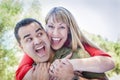 Attractive Mixed Race Couple Piggyback at the Park Royalty Free Stock Photo
