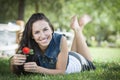 Attractive Mixed Race Teen Girl Portrait Laying in Grass