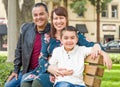 Attractive Mixed Race Young Family Portrait on a Park Bench Royalty Free Stock Photo