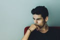 Attractive modern young brazilian white guy sitting in thoughts