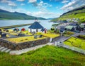 Attractive morning view of Haldarsvik village with Haldorsvikar Church. Wonderful summer scene of Streymoy island, Faroe Islands,