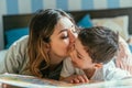 Attractive mother kissing cheek of cute Royalty Free Stock Photo