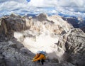 Attractive mountain climber on a steep and hard Via Ferrata climb in the Italian Dolomites