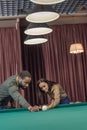 attractive multiethnic man and woman playing in pool