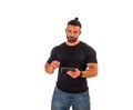 Attractive muscular man using electronic tablet in studio