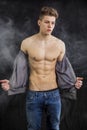 Attractive muscular trendy young man undressing Royalty Free Stock Photo