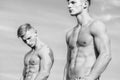 Attractive muscular twins. Muscular healthy athletic body. Sexy torso attractive body. Masculinity concept. Men twins