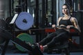 Attractive muscular woman CrossFit trainer do workout on indoor rower Royalty Free Stock Photo