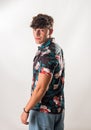 Attractive, muscular young man smiling, wearing open hawaian style shirt Royalty Free Stock Photo