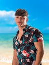 Attractive, muscular young man smiling, wearing open hawaian style shirt Royalty Free Stock Photo