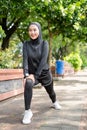 muslim asian woman strecth her leg during sport time outdoor Royalty Free Stock Photo