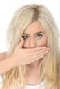Attractive Natural Shocked Young Woman With a Hand over Mouth Looking Embarrassed