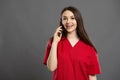 Attractive nurse with braces talking on her mobile phone to a patient Royalty Free Stock Photo