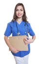 Attractive nurse with long dark hair and file Royalty Free Stock Photo