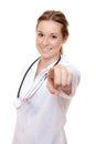 Attractive nurse pointing with finger