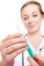 Attractive nurse preparing syringe Royalty Free Stock Photo