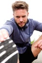 Attractive older athlete outside doing stretch Royalty Free Stock Photo