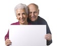 Attractive older couple holding blank billboard