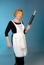 Attractive older lady with rolling pin