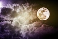 Attractive photo of a nighttime sky with cloudy and bright full moon. Beautiful nature use as background. Outdoors. Royalty Free Stock Photo