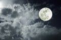 Attractive photo of a nighttime sky with cloudy and bright full moon. Beautiful nature use as background. Outdoors. Royalty Free Stock Photo