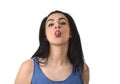 Attractive and playful woman sticking out tongue in funny fresh face expression mocking
