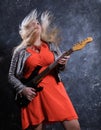 Attractive plump rocker woman with electric guitar Royalty Free Stock Photo