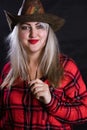 Attractive plump woman dressed in cow boy style