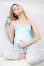 Attractive pregnant girl drinks water Royalty Free Stock Photo