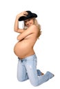 Attractive pregnant woman in a black hat
