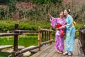 Attractive pretty female travelers wearing kimono Royalty Free Stock Photo