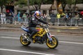 Attractive Red bull branded motorbike rider on his motorbike performing