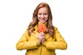 attractive redhead stylish girl in yellow leather jacket holdig lollipop