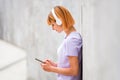 Attractive redhead woman listening to music Royalty Free Stock Photo