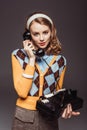 Attractive Retro Styled Girl Talking By Vintage Stationary Telephone